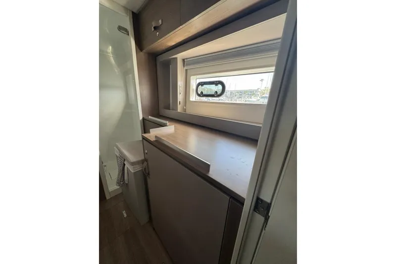 Slide: The Image of Modern interior of 2023 Bali 4.6 yacht with sleek cabinetry and window view. - 76