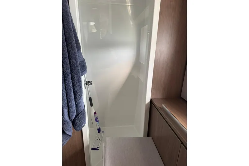 Slide: The Image of Modern bathroom interior in 2023 Bali 4.6 model, featuring sleek shower and wooden accents. - 78