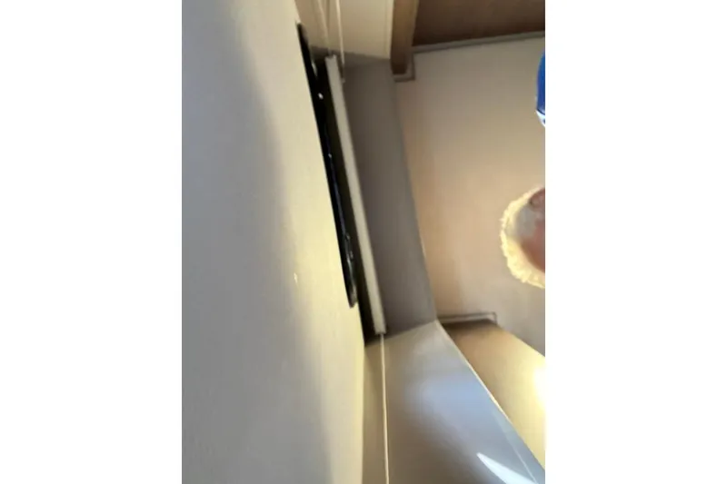 Slide: The Image of Interior view of a Bali 4.6 yacht, 2023 model, showing ceiling and partial person. - 82