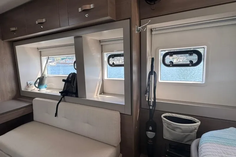 Slide: The Image of Interior of 2023 Bali 4.6 yacht with windows, seating, and storage. - 84