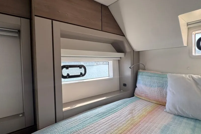 Slide: The Image of Modern cabin interior of 2023 Bali 4.6 yacht with cozy bed and window view. - 85