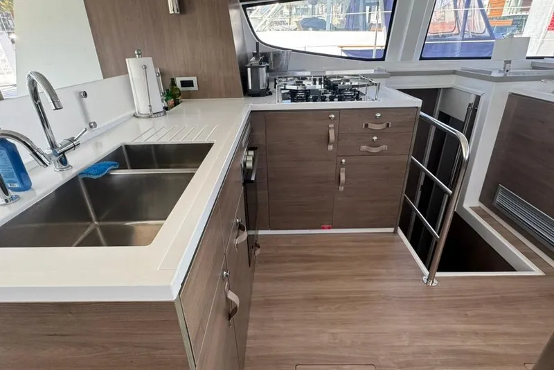Slide: The Image of Modern kitchen interior on 2023 Bali 4.6 yacht with dual sinks and stove. - 88