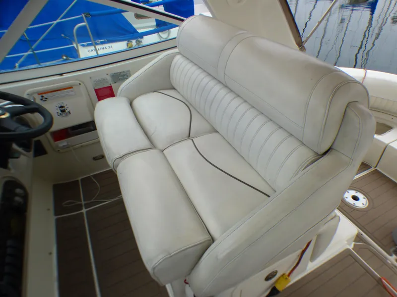 Slide: The Image of Interior of 2001 Cruisers Yachts 340 Express with beige seating. - 11
