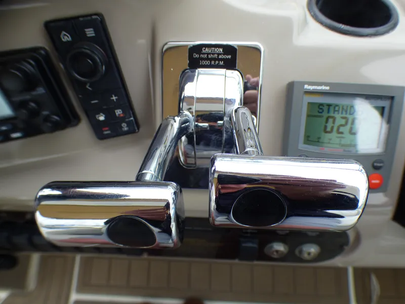 Slide: The Image of Control console of 2001 Cruisers Yachts 340 Express with controls. - 13