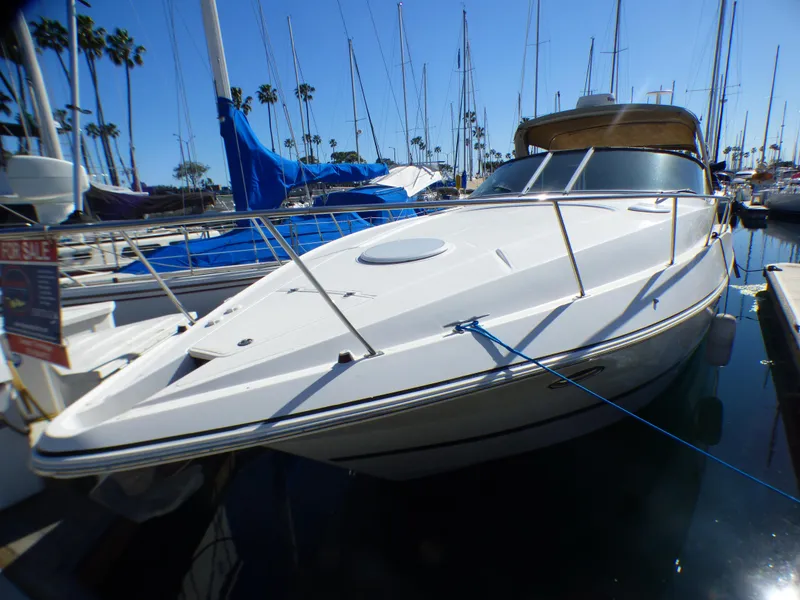 Slide: The Image of 2001 Cruisers Yachts 340 Express docked on a sunny day. - 2
