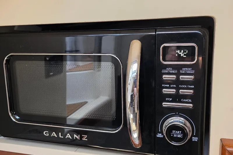 Slide: The Image of Black Galanz microwave with digital display showing 42 seconds. - 20