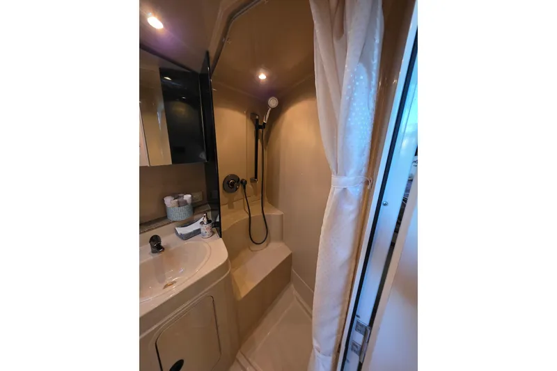 Slide: The Image of Bathroom interior of 2001 Cruisers Yachts 340 Express with shower and sink. - 22
