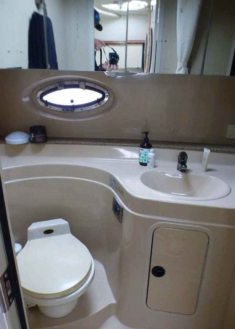 Slide: The Image of Bathroom in 2001 Cruisers Yachts 340 Express model. - 25