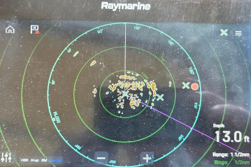 Slide: The Image of Radar display on a 2001 Cruisers Yachts 340 Express, showing depth of 13 feet. - 30