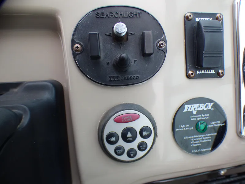 Slide: The Image of Control panel of 2001 Cruisers Yachts 340 Express with searchlight controls. - 37