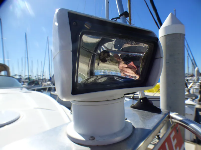 Slide: The Image of Close-up of a spotlight on a 2001 Cruisers Yachts 340 Express. - 38