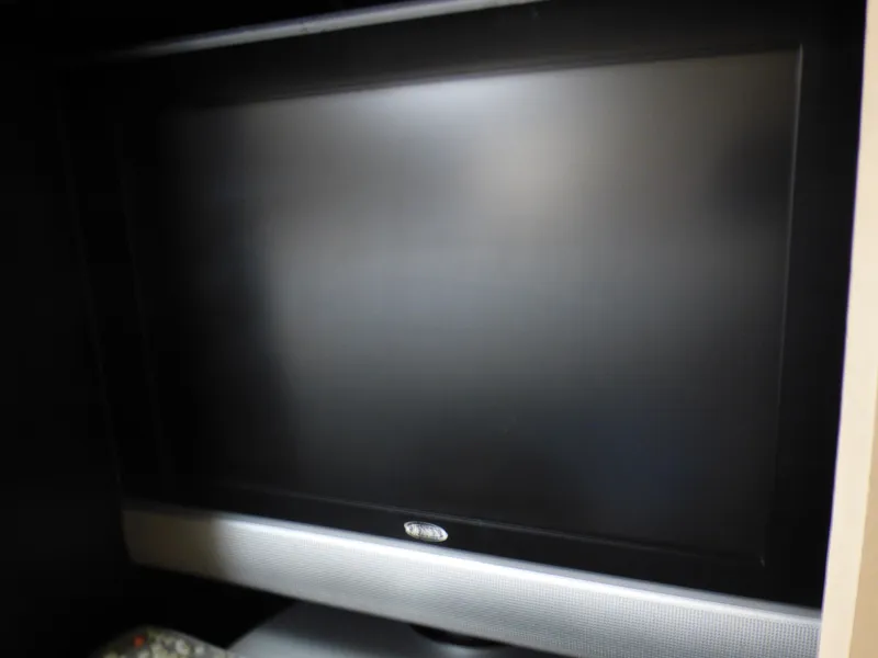 Slide: The Image of Flat-screen TV in a 2001 Cruisers Yachts 340 Express. - 44