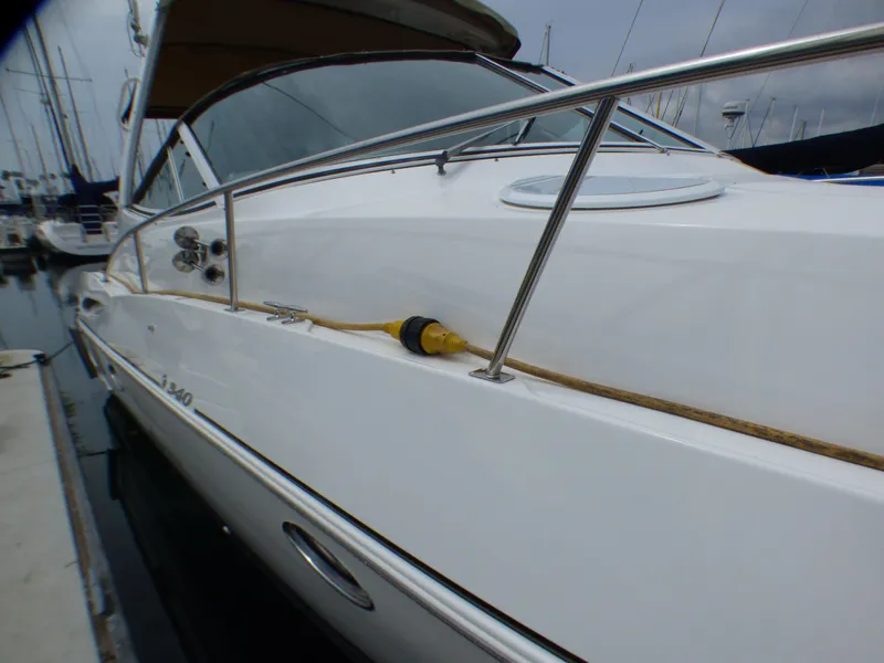 Slide: The Image of 2001 Cruisers Yachts 340 Express docked at marina. - 5