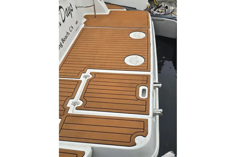 Slide: The Image of Teak deck of 2001 Cruisers Yachts 340 Express, featuring sleek design and craftsmanship. - 54