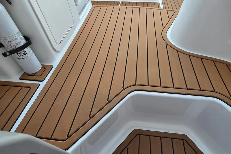 Slide: The Image of Teak-style deck flooring on 2001 Cruisers Yachts 340 Express boat. - 55
