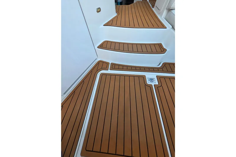 Slide: The Image of Teak deck flooring on 2001 Cruisers Yachts 340 Express boat. - 56