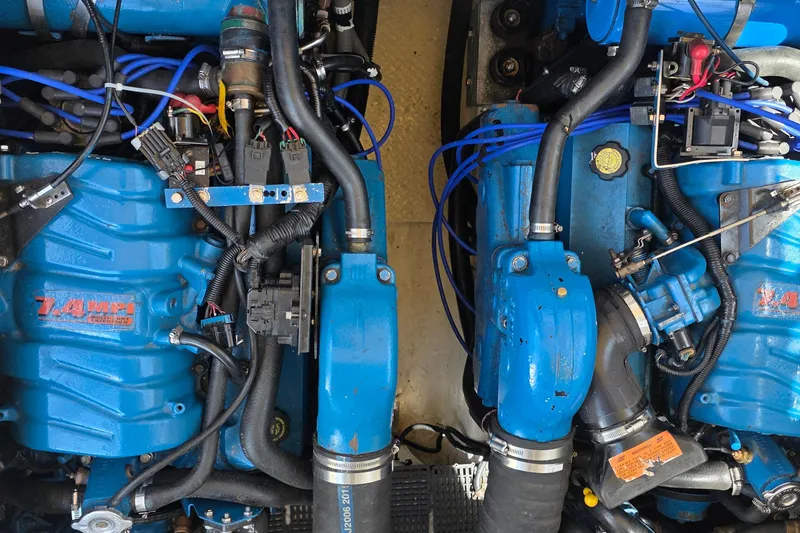 Slide: The Image of Twin blue marine engines in a 2001 Cruisers Yachts 340 Express boat. - 58
