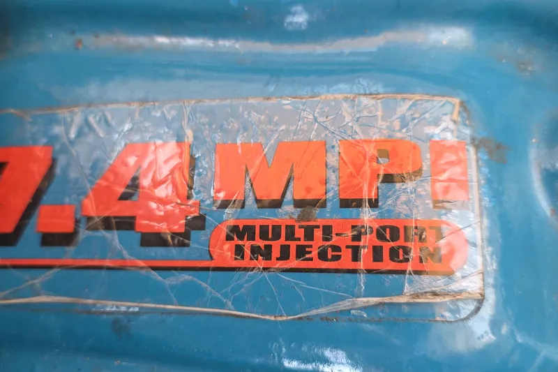 Slide: The Image of 7.4 MPI Multi-Port Injection label on blue surface, 2001 Cruisers Yachts 340 Express. - 59