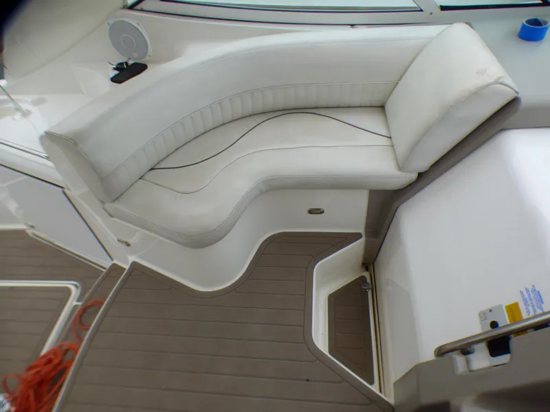 Slide: The Image of Interior of 2001 Cruisers Yachts 340 Express with white seating area. - 9