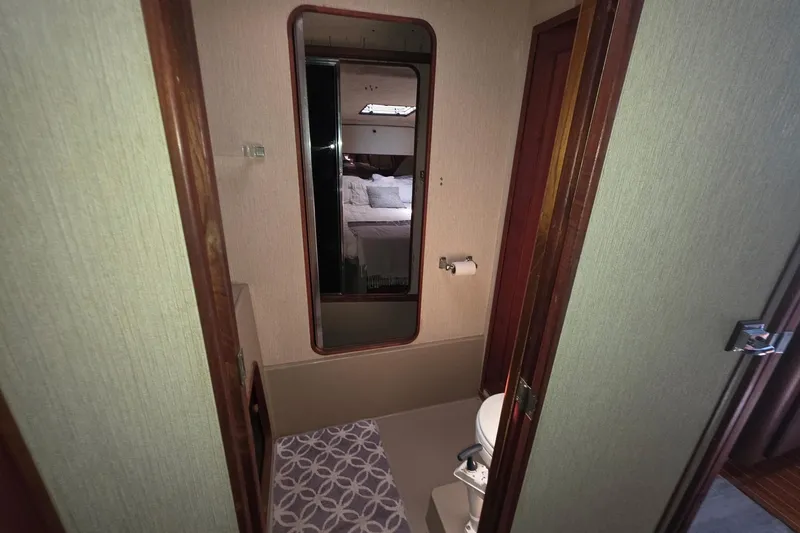Slide: The Image of Bathroom interior of 1986 Bayliner 3888 MY Sedan yacht with mirror and toilet. - 15