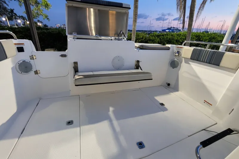 Slide: The Image of The image shows the cockpit of a 2017 Cutwater C-24 Coupe with bench seating and speakers. - 14
