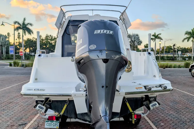 Slide: The Image of 2017 Cutwater C-24 Coupe with Yamaha 300 engine, parked outdoors at sunset. - 50