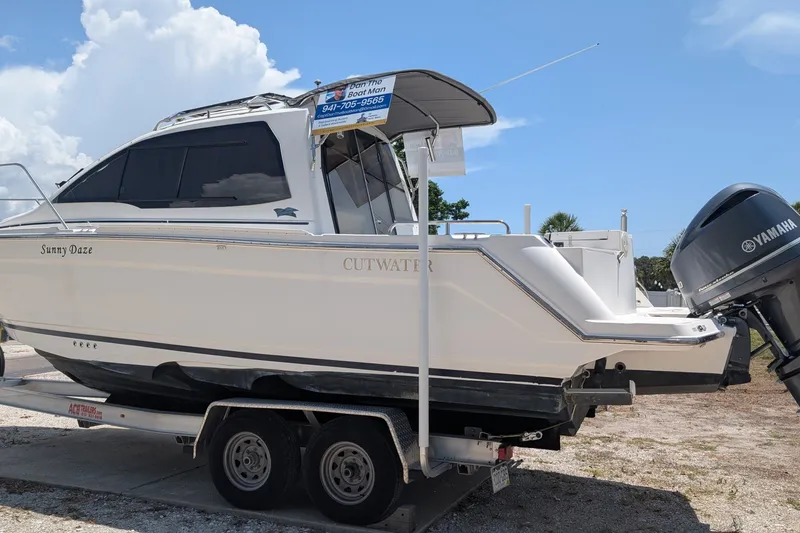 Slide: The Image of 2017 Cutwater C-24 Coupe boat on trailer with Yamaha outboard motor. - 3
