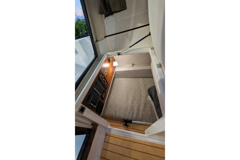 Slide: The Image of Interior cabin view of a 2017 Cutwater C-24 Coupe boat with control panel and lighting. - 21