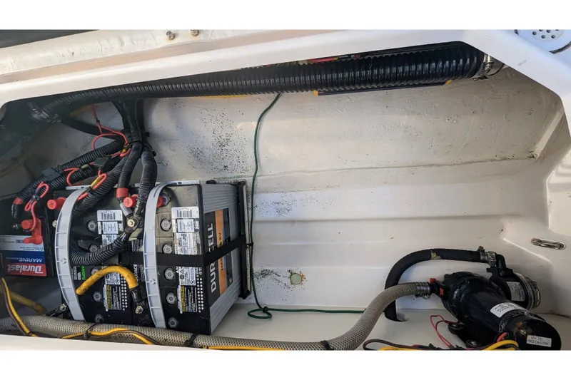 Slide: The Image of 2017 Cutwater C-24 Coupe engine compartment with batteries and wiring. - 47