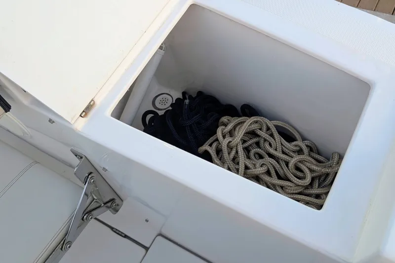 Slide: The Image of Storage compartment with ropes on a 2017 Cutwater C-24 Coupe boat. - 17