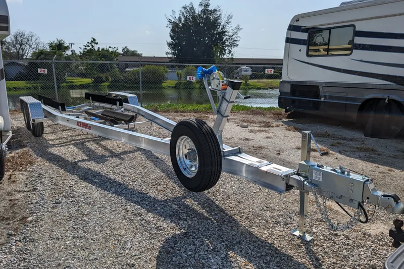 Slide: The Image of Boat trailer parked on gravel, near RV, for 2017 Cutwater C-24 Coupe. - 57