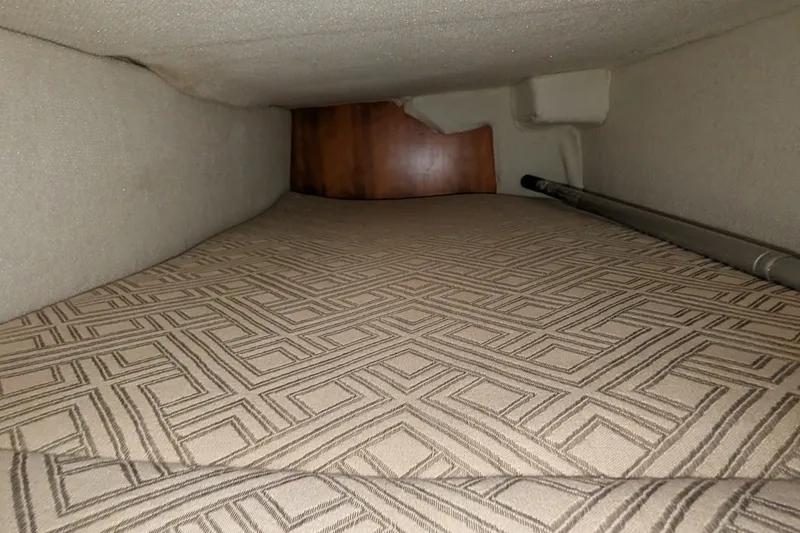 Slide: The Image of Interior cabin of 2017 Cutwater C-24 Coupe with patterned bedding. - 23