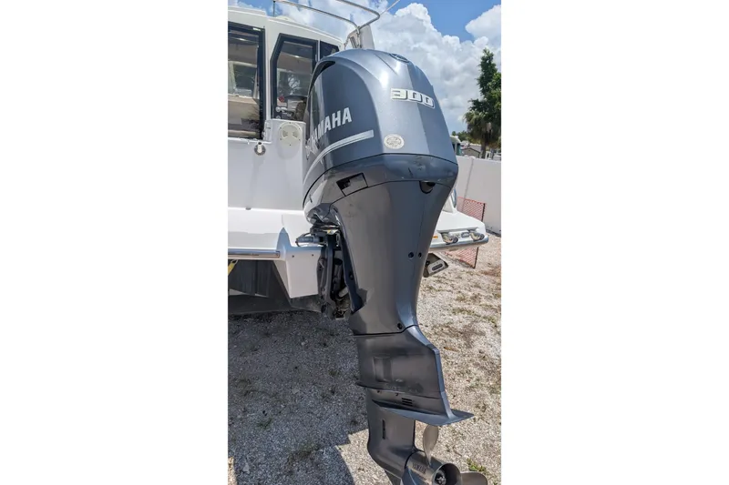 Slide: The Image of 2017 Cutwater C-24 Coupe with Yamaha 300 outboard motor, parked on gravel. - 10