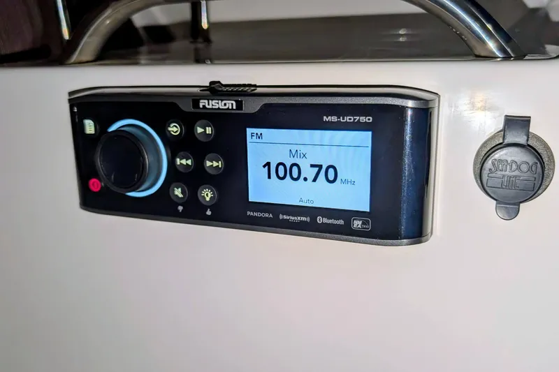 Slide: The Image of Fusion MS-UD750 stereo system on 2017 Cutwater C-24 Coupe, tuned to 100.70 MHz FM. - 25