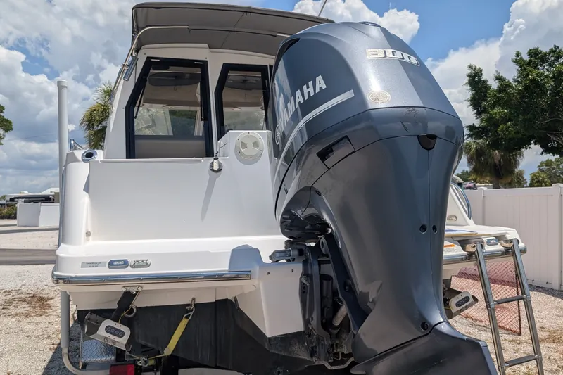 Slide: The Image of 2017 Cutwater C-24 Coupe with Yamaha outboard motor, rear view. - 9
