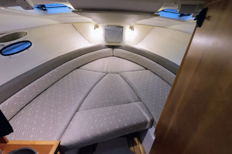 Slide: The Image of 2017 Cutwater C-24 Coupe cabin interior with cozy V-berth and ambient lighting. - 40