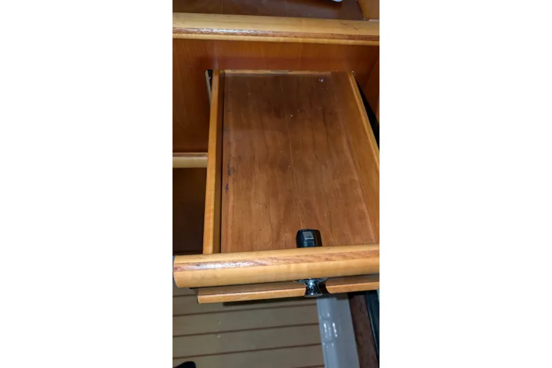 Slide: The Image of Wooden drawer inside 2017 Cutwater C-24 Coupe boat interior. - 38