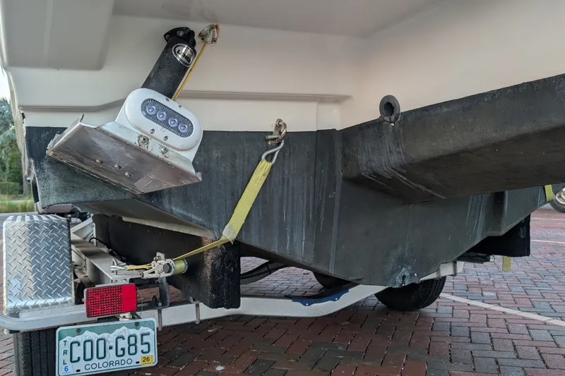 Slide: The Image of Rear view of 2017 Cutwater C-24 Coupe boat on trailer with Colorado license plate. - 55