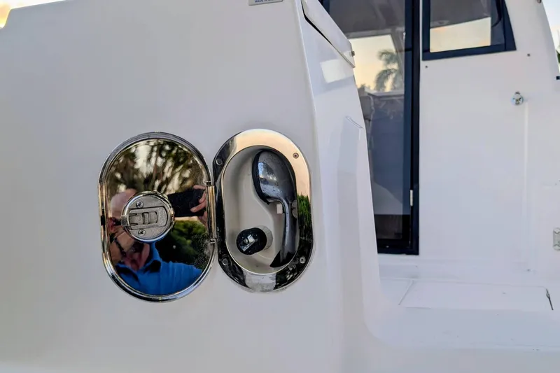 Slide: The Image of Close-up of a 2017 Cutwater C-24 Coupe boat's exterior detail with reflection. - 51