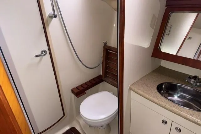 Slide: The Image of 2007 Hunter 38 yacht bathroom with shower, toilet, and sink. - 27