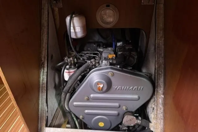 Slide: The Image of Yanmar engine inside a 2007 Hunter 38 sailboat, showcasing mechanical components. - 24