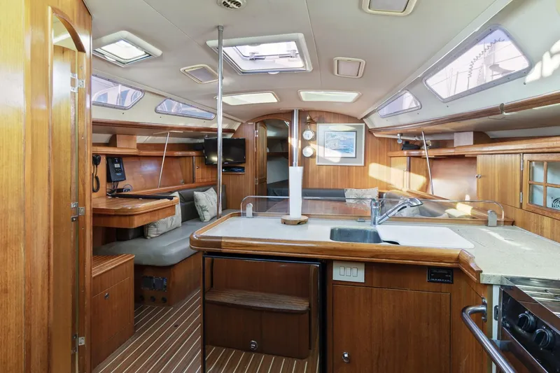 Slide: The Image of Interior of a 2006 Hunter 38 sailboat with wood finishes and modern amenities. - 20