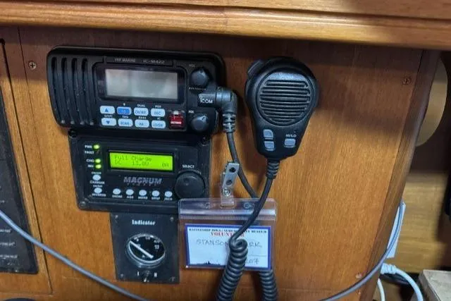 Slide: The Image of Boat communication equipment on a 2006 Hunter 38, featuring radio and microphone setup. - 23