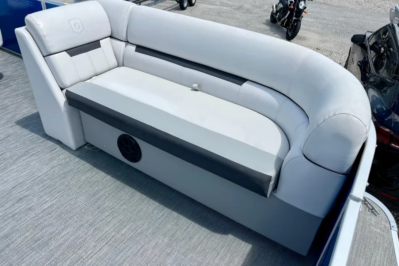 Slide: The Image of 2024 Godfrey Sweetwater 2286 SFL boat seating with gray upholstery and integrated speaker. - 10