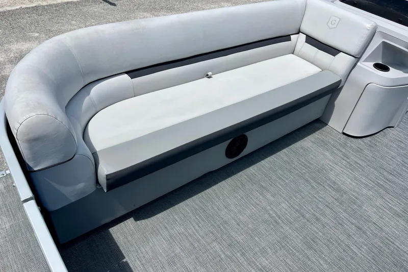 Slide: The Image of 2024 Godfrey Sweetwater 2286 SFL boat interior with gray cushioned seating. - 11