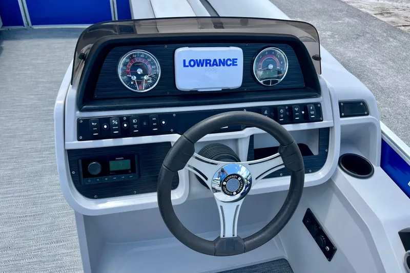 Slide: The Image of Steering console of 2024 Godfrey Sweetwater 2286 SFL with Lowrance display and controls. - 15