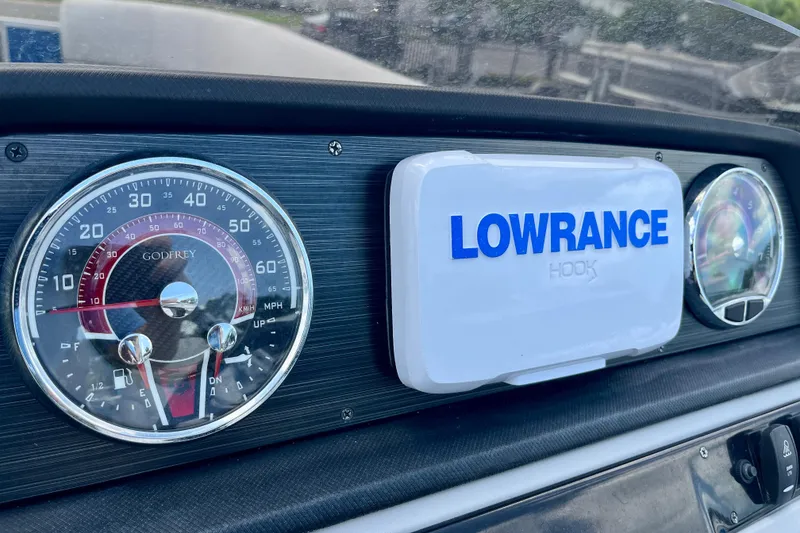 Slide: The Image of Dashboard of 2024 Godfrey Sweetwater 2286 SFL with Lowrance Hook display. - 17