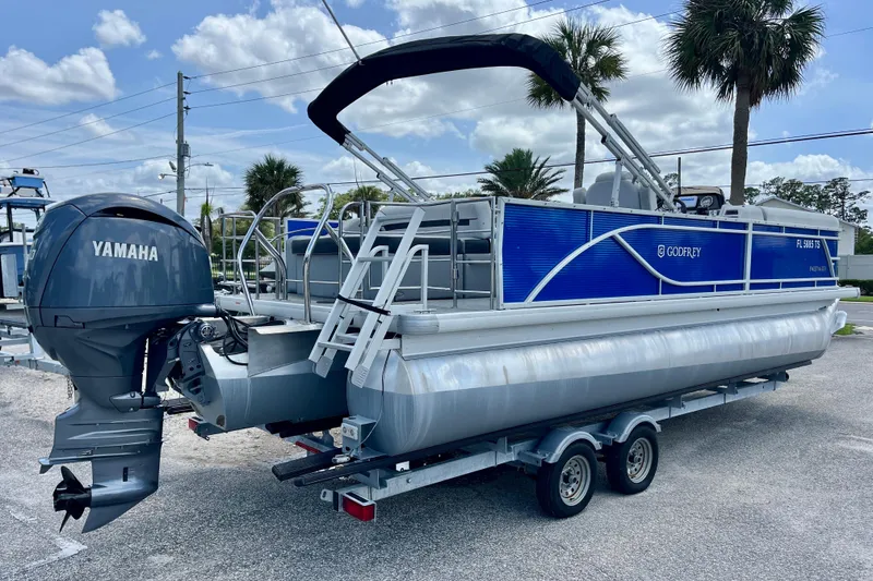 Slide: The Image of 2024 Godfrey Sweetwater 2286 SFL pontoon boat with Yamaha engine on trailer. - 3