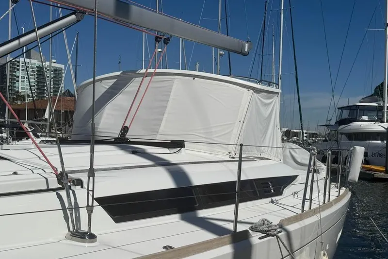 Slide: The Image of 2017 Jeanneau Sun Odyssey 449 sailboat docked at marina, featuring sleek design and modern rigging. - 10
