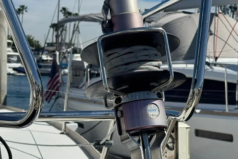 Slide: The Image of Close-up of a 2017 Jeanneau Sun Odyssey 449 sailboat's rigging system at a marina. - 14